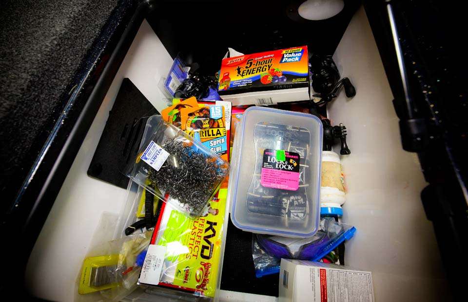The box includes a veritable smorgasbord of pieces and parts from extra reels, glue, glasses, baits and 5-Hour Energy. 