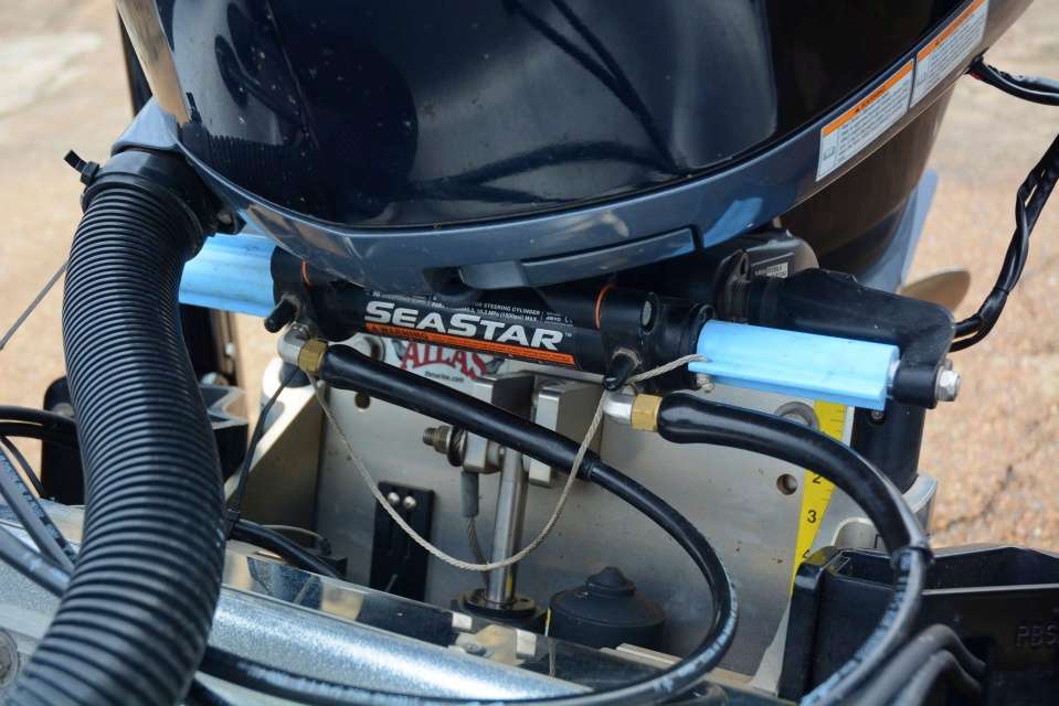 The blue parts are T-H Marine Stop Locks using hydraulics to keep the outboard from shifting from side to side. âThey are easy to install and really keep the motor in place when trailering.â 
