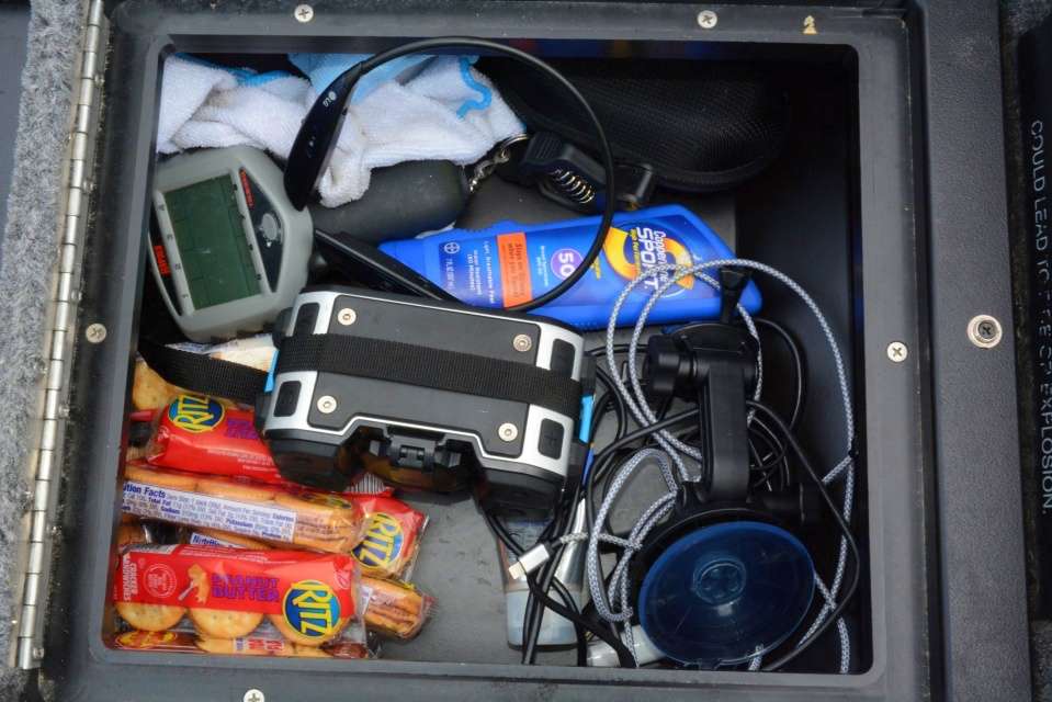 This storage compartment between driver and passenger seats has something for everyone. âI eat more Ritz Crackers than anyone I know and youâll find them all over my boat.â 
