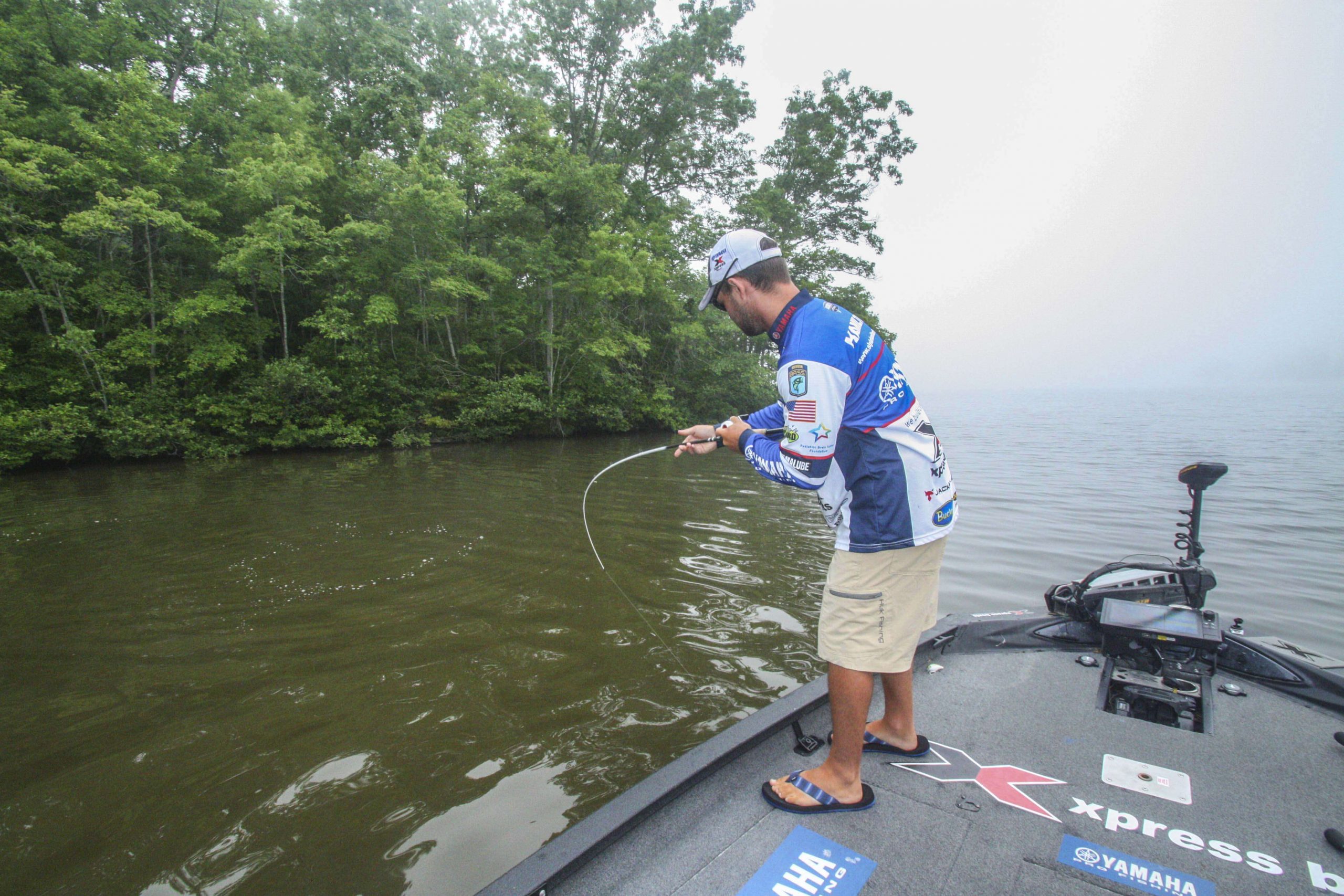 <b>7:32 a.m.</b> Hamilton spots a stump just beneath the surface and casts the popper to the cover, and a bass smashes it! The fish races off the stump, then stops. âHeâs got my line wrapped around something,â Hamilton says. âI havenât got braid on this reel, so Iâve got to ease him out of that cover.â