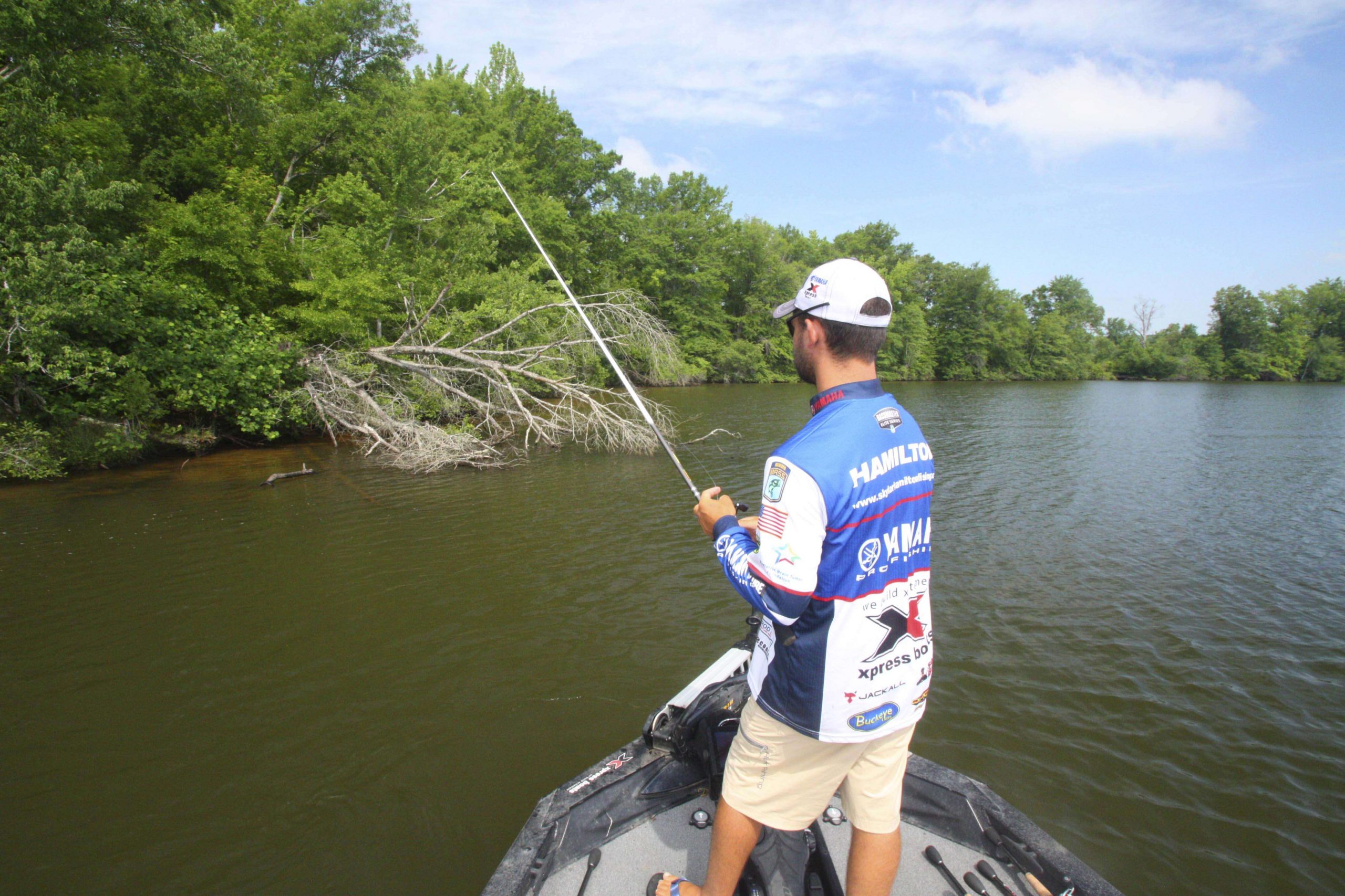 <b>10:38 a.m.</b> Hamilton moves straight across the lake to flip several blowdowns with creatures and jigs. <br>
<b>10:47 a.m.</b> He ties on a black 5/8-ounce Buckeye Mop Jig with a 5-inch green pumpkin Jackall craw trailer. âThis jig has an extremely long skirt; together with that big trailer, it presents a bulky profile in these dense branches.â
