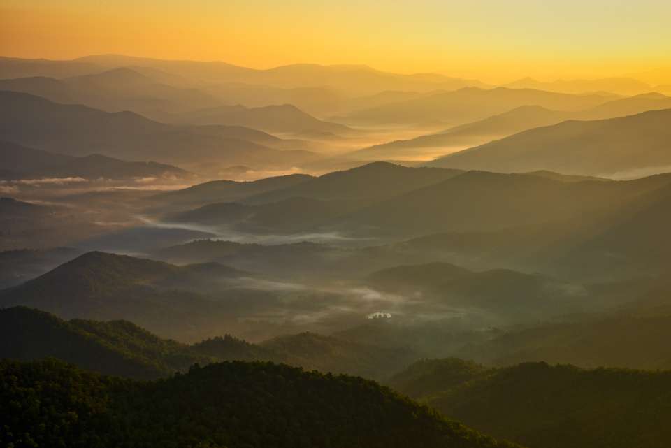 As the sun rose above the horizon, it threw beautiful rays across the mountain ridges that really highlighted the rising fog in the valleys. Smoky Mountains, indeed.