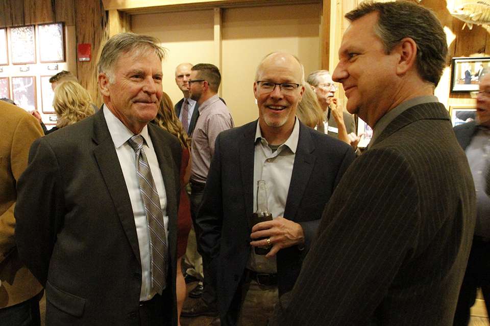 Sanders, Jim Sexton (middle) and Mike McKinnis chat while everyone mingles.