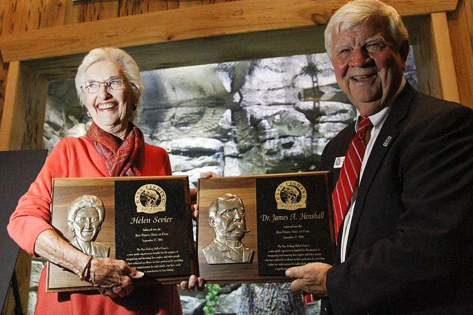 Sevier (left) and Precht (right) honor Dr. James Henshall who also was inducted in the Hall of Fame.