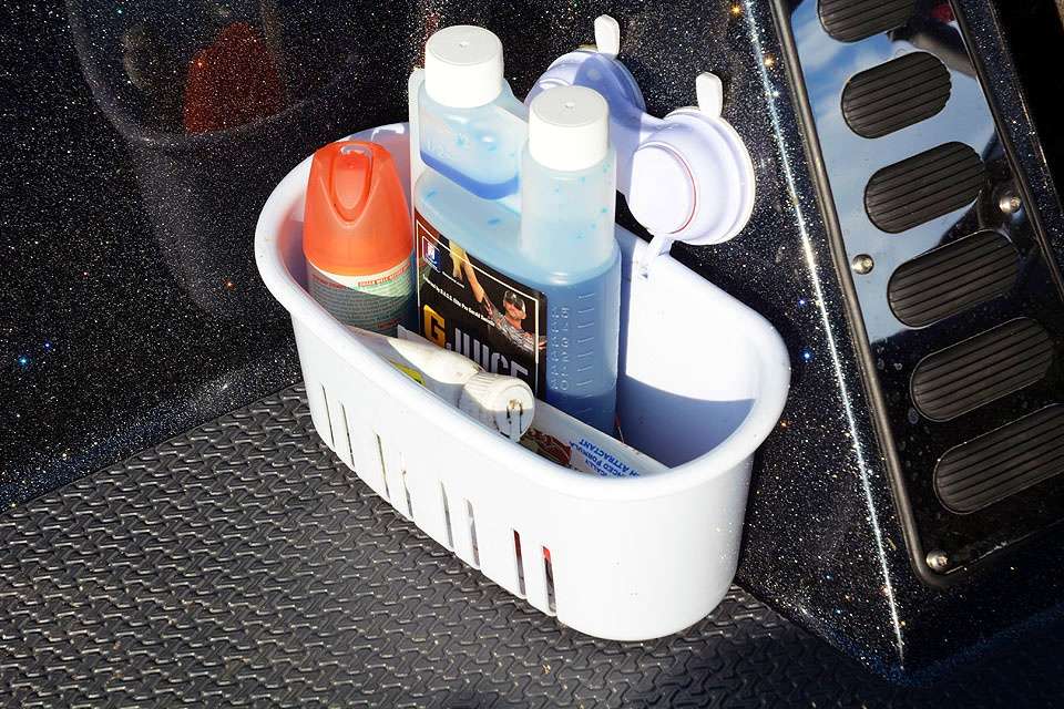 Lintner picked this up at Home Depot. What caught his eye were the suction cups. Those secure the handy dandy caddy to the outside of the console, keeping loose odds and ends from rolling around in the floor.  
