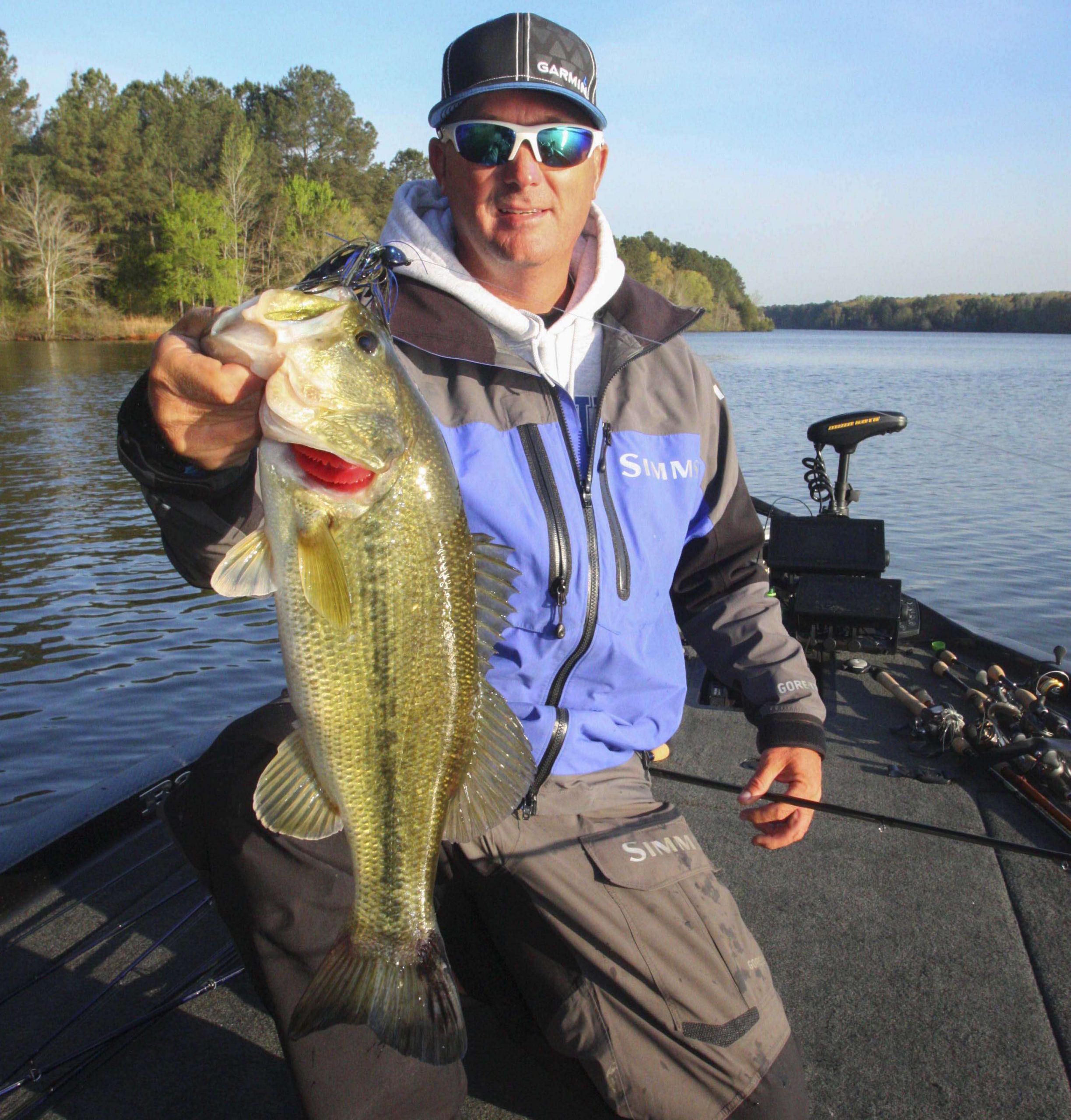 <b>7:41 a.m.</b> Grigsby flips the jig to a submerged branch on a shallow point, swings back his rod and launches his first keeper bass of the day, 3 pounds, 11 ounces, into his boat. âAll right! I hopped the jig over that branch and saw the fish swim up and eat it! This is a big male, and he wasnât on a nest. They may be staging out here around isolated pieces of cover.â<br>
<p>
<b>6 HOURS LEFT</b><br>
<b>7:45 a.m.</b> Grigsby moves to the back of a shallow pocket to flip the jig beneath overhanging bushes. No sign of spawning beds here, either.<br>
<b>7:52 a.m.</b> Grigsby is wind-drifting uplake while chunking the spinnerbait.<br>
<b>7:57 a.m.</b> Grigsby pitches the jig to a shallow stickup, swings and misses. âI saw that fish flash on it; looked like a 2-pounder. He took my trailer.â