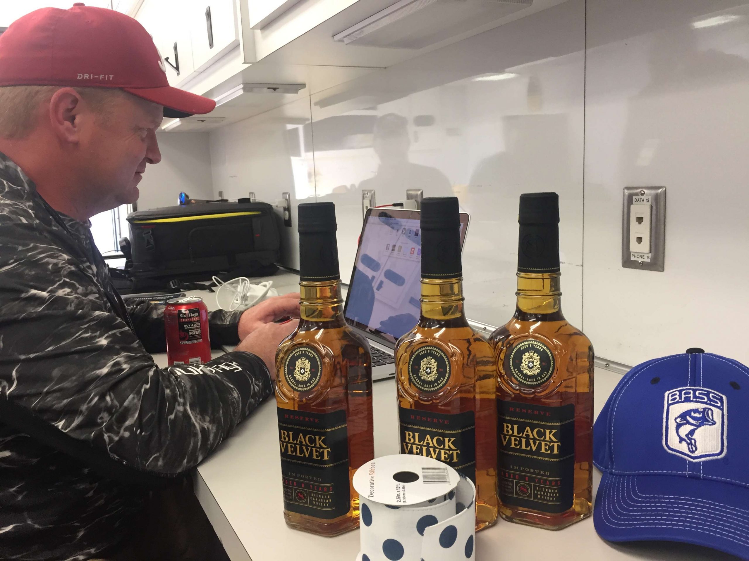 <em>B.A.S.S. Times</em> editor Bryan Brasher had no problem sharing his workspace with the prize bottles. 