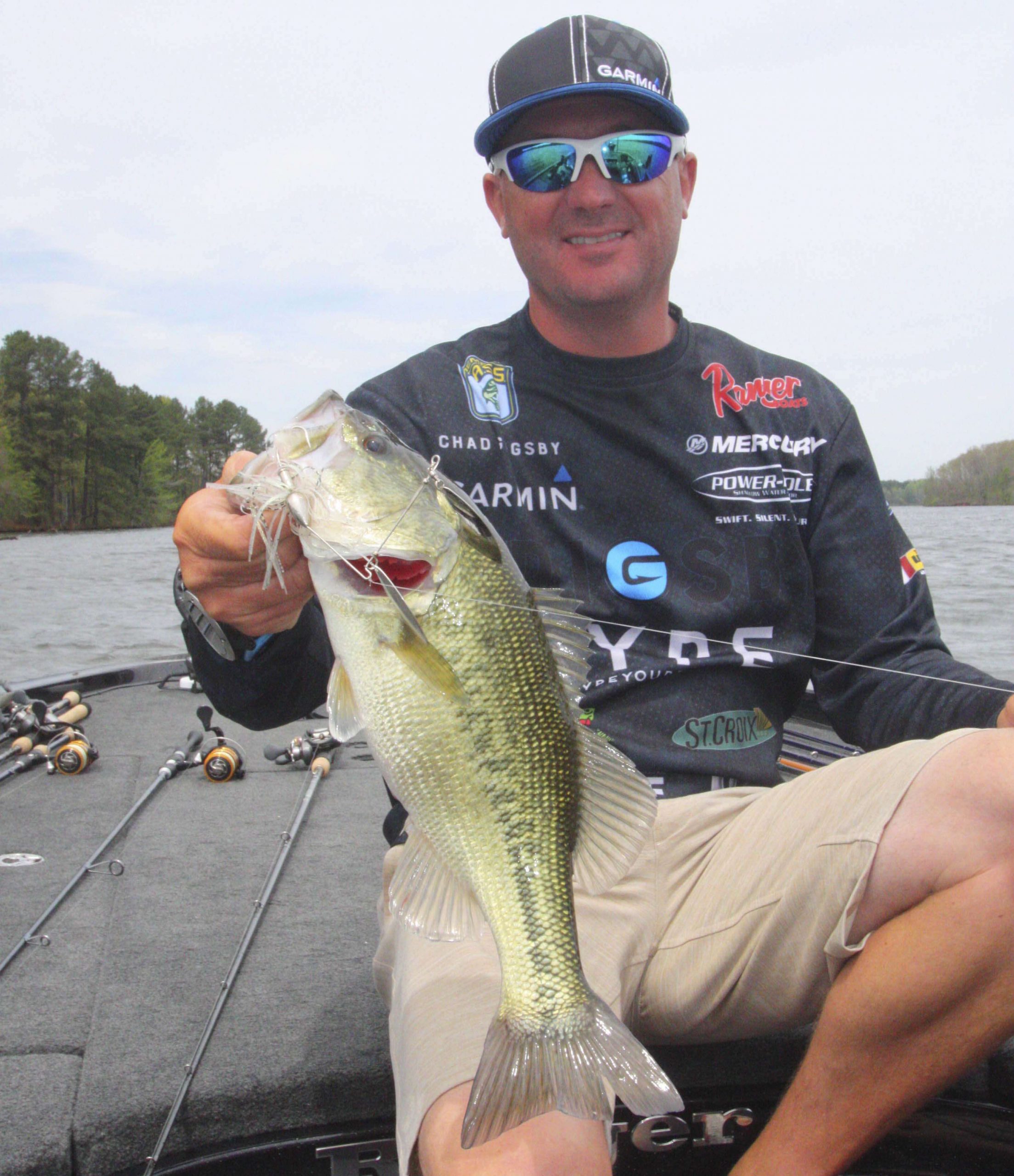 <b>1:01 p.m.</b> Grigsby catches his fifth keeper, 2 pounds, 5 ounces, off the point on the spinnerbait. <br>
<b>1:05 p.m.</b> Still pounding the point with the spinnerbait. âThereâs a ton of shad here; theyâre following the spinnerbait on every cast.â<br>
<b>1:11 p.m.</b> He hops the jig around a submerged log on the point.<br>
<b>1:20 p.m.</b> Grigsby rounds the point and continues along a channel bank with the jig and spinnerbait.<br>
<b>1:37 p.m.</b> With minutes remaining, Grigsby has run downlake to hit another windblown point with the spinnerbait.<br>
<b>1:45 p.m.</b> Grigsbyâs time is up. Heâs had a good day on Lake B, boating five keepers with a total weight of 14 pounds, 12 ounces.
<p>
<b>THE DAY IN PERSPECTIVE</b><br>
â¨âI have no complaints about my performance today,â Grigsby told Bassmaster. âI determined pretty quickly that there are very few bass spawning yet; four of my five keepers were staging on the main lake on or near wood cover. If I were to fish here tomorrow, Iâd keep hitting that main-lake wood, especially on points. But knowing that things can change very quickly this time of year, Iâd also spend some time in shallow water looking for cruising and bedding fish once the sun got high.â<br>
<p>  
<b>WHERE AND WHEN CHAD GRIGSBY CAUGHT HIS KEEPER BASS</b><br>
3 pounds, 11 ounces; 1/2-ounce black and blue Venom jig with matching Zoom Super Chunk trailer; branch on shallow point; 7:41 a.m.<br>
2 pounds, 2 ounces; same lure as No. 1; spawning bed; 9:30 a.m.<br>
3 pounds, 14 ounces; same lure as No. 1; submerged log on clay point; 9:45 a.m.<br>
2 pounds, 12 ounces; 1/2-ounce white Venom spinnerbait; main-lake bank; 9:53 a.m.<br>
2 pounds, 5 ounces; same lure as No. 4; main-lake point; 1:01 p.m.<br>
TOTAL: 14 POUNDS, 12 OUNCES