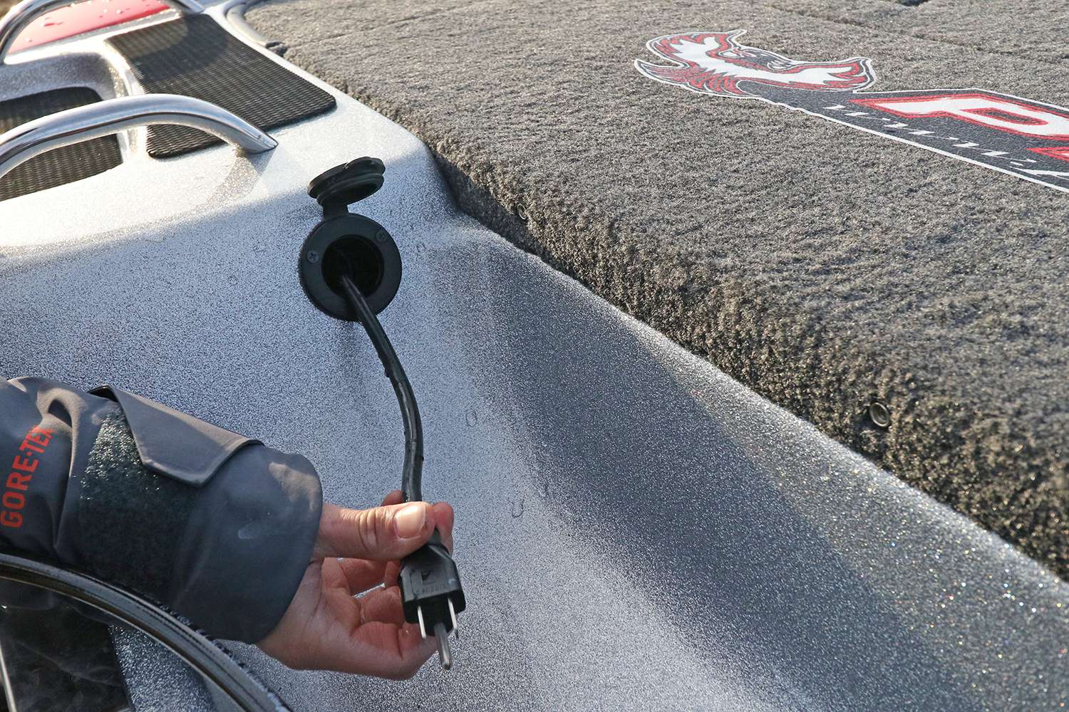 A convenient retractable on-board charger cord is just inside the splashwell. 
