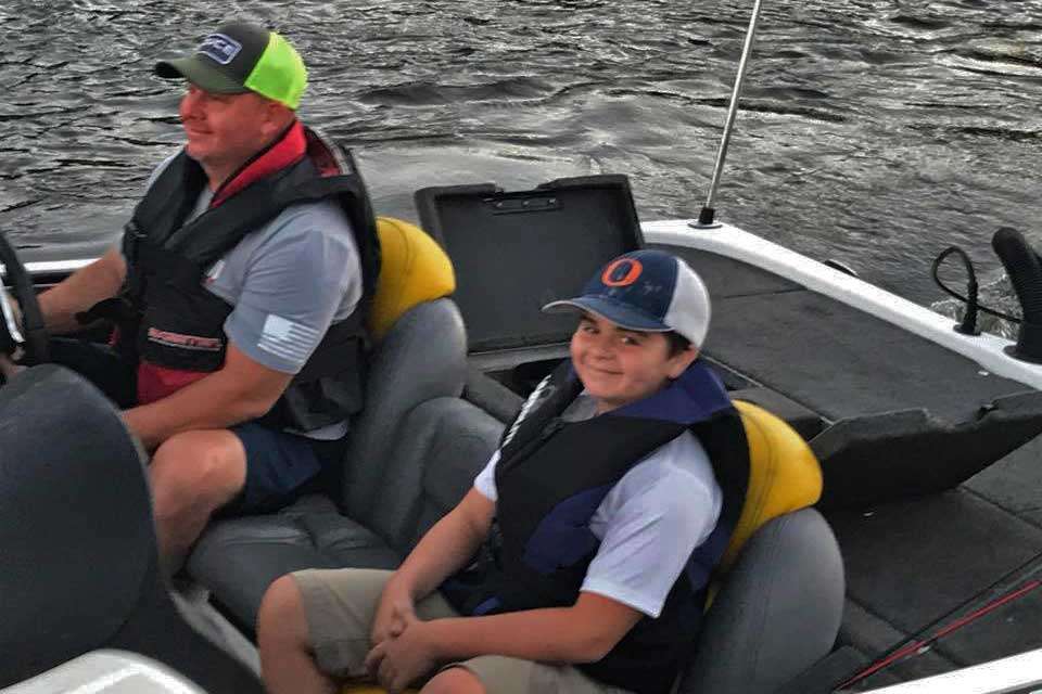 Braden Wilson smiles as he passes the dock with father, Brian Wilson. Winning the youth division would win a tremendous prize of a Humminbird Helix7 plus $500.