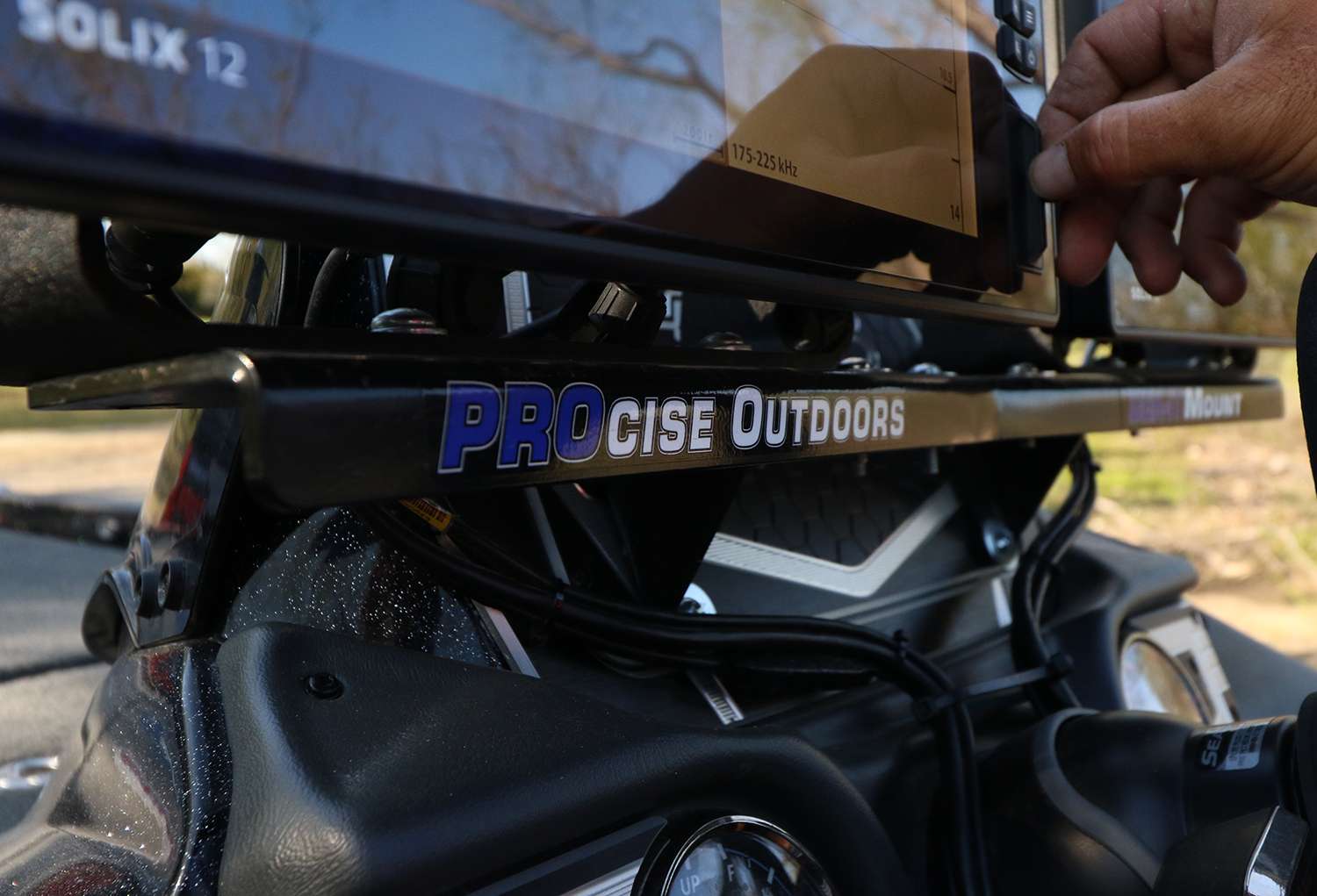 The dash-mounted Solix units are held by a PROcise Outdoors mount. They don't even budge.