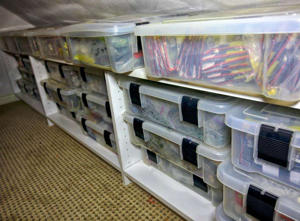 More walls are filled with containers full of baits and equipment. 