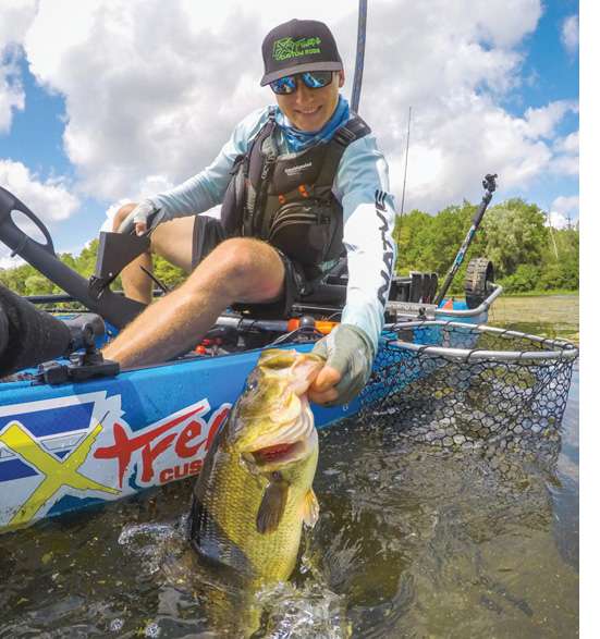 One reason 22-year-old Bogdan Korostetskyi was Angler of the Year and won two of five tournaments against 120-plus competitors on the Michigan Kayak Trail was his efficiency. You can watch on his 75-plus YouTube videos (Kayak Outbreak channel) as he nets a bass and immediately sticks the net handle into an innovative yet simple net-handle holder he installed on his Native Watercraftâs seat. Korostetskyi started with a length of 1 1/2-inch PVC pipe and cable ties but recently repurposed a fishing rod stager that comes standard with Nativeâs Titan model kayaks. The setup keeps the fish in the water while he quickly preps his measuring board and phone to take the fishâs picture for the âCatch-Photo-Releaseâ contests.
