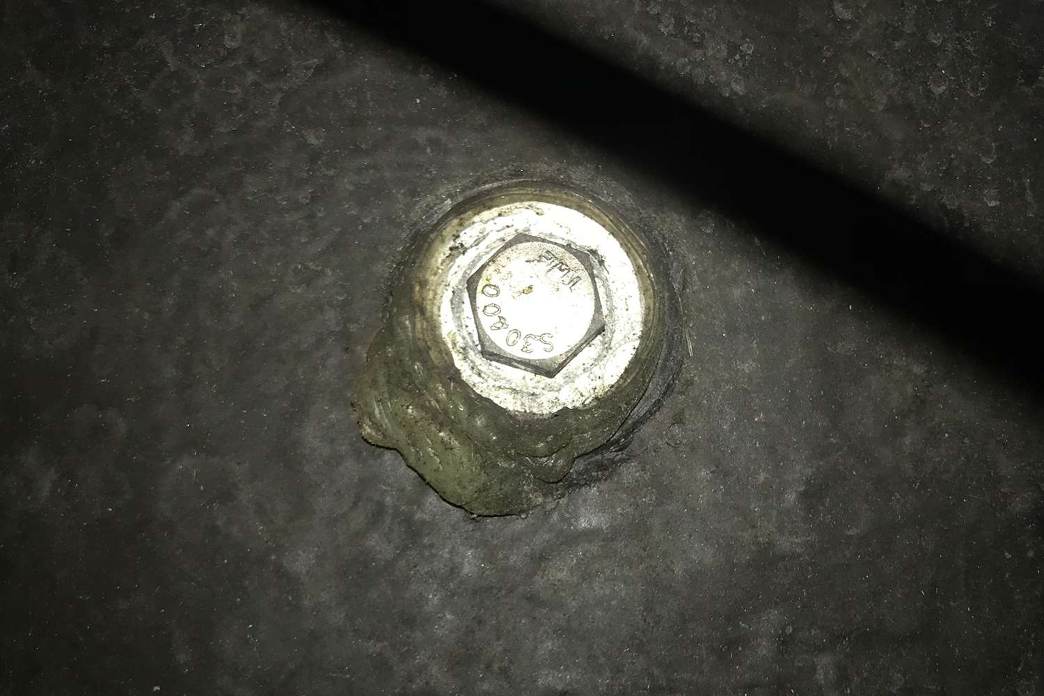 Here is one of the bottom bolts inside your boat. There are two that are easily accessed from that round port in the splashwell. 