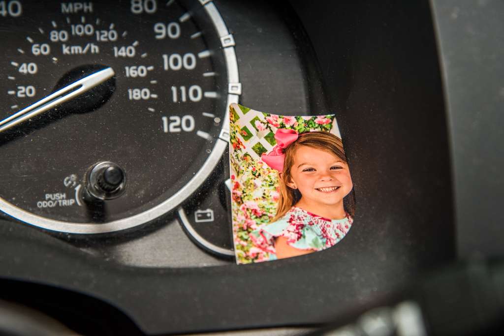 To keep him company, Caleb Sumrall keeps a photo of his daughter on his dashboard. 