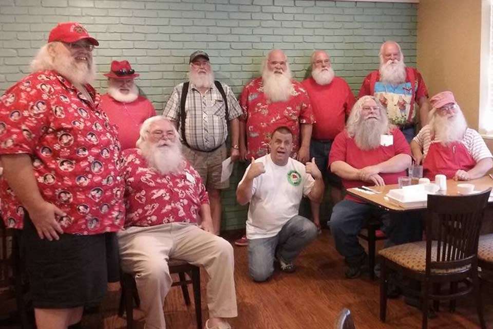 Bethurem (back right) visits with a group of Ozark Santas. 