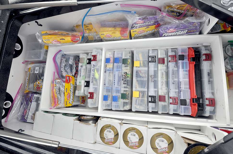 The inside of the middle compartment is well organized with flat boxes in the middle, plastic bags with soft plastics on one side and bulk spools of line on the other side.
