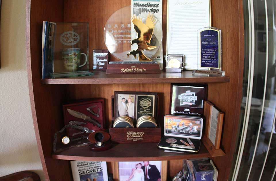 Upon closer inspection, there are many things, awards and commemorative items, that relate to fishing.