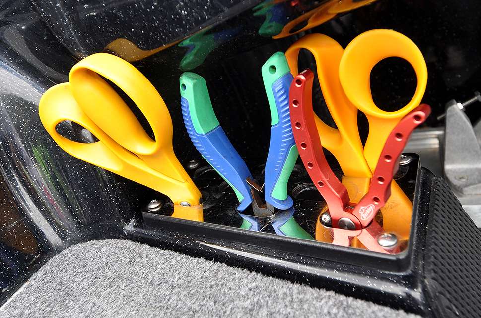 Assorted fishing tools stay close at hand in a holder next to the driverâs console.
