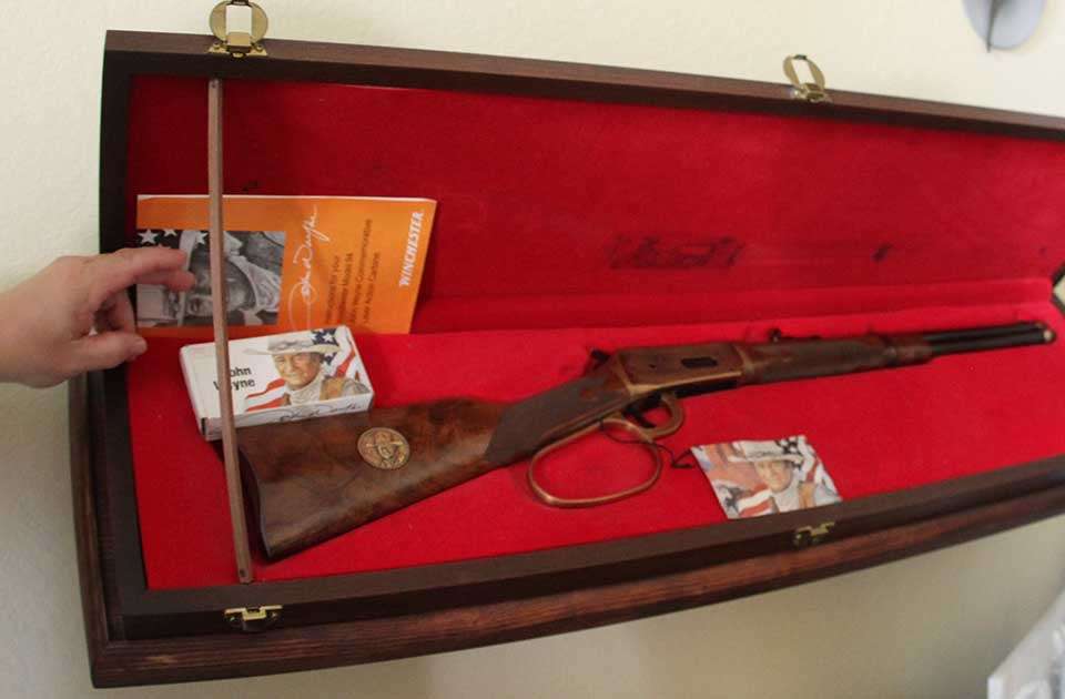 This is a John Wayne 100th anniversary Winchester Model 1892 along with a signed box of John Wayne ammo.