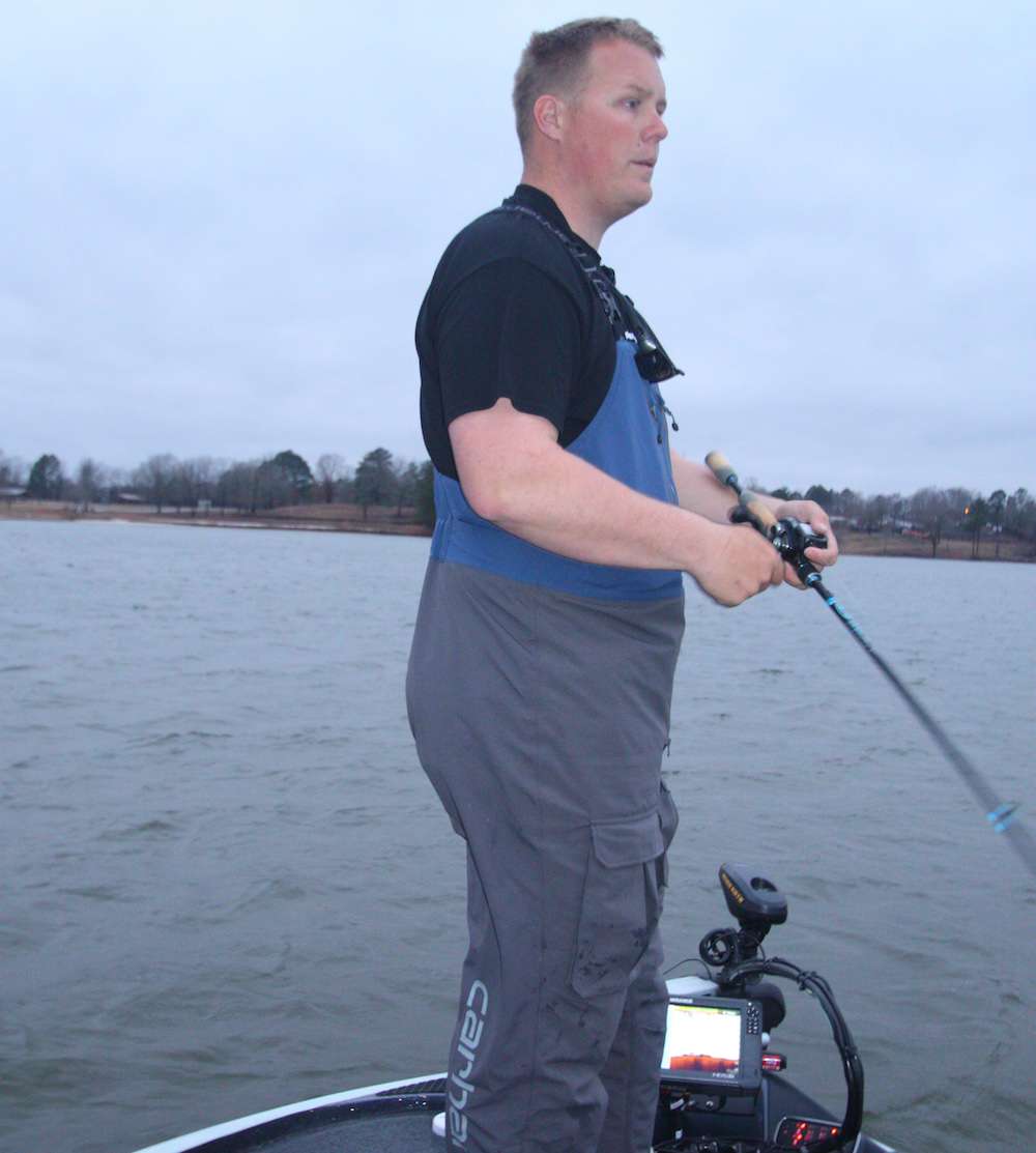 <b>7:07 a.m.</b> Whitaker abandons the rockpile for a nearby cove and casts the lipless crankbait to a seawall. âThe water is 3 degrees warmer in this cove, probably because itâs sheltered from the wind.â <br>
<b>7:09 a.m.</b> He hits a residential boat ramp with the Quake 70. <br>
<b>7:11 a.m.</b> The lipless crank ticks a submerged brushpile during the retrieve. Whitaker reels in quickly and casts the jig to the cover. <br>
<b>7:15 a.m.</b> Whitaker moves deeper into the cove while casting a 1/2-ounce chartreuse and white TrueSouth Bullet spinnerbait around boat docks. The lure has gold blades â one willow, one Colorado. âItâs cloudy now, but itâs supposed to clear up as this front moves through. Personally, I like sunny conditions way better than cloud cover in winter. The sun warms up shallow water and positions bass tighter to cover.â 
<b>7:21 a.m.</b> He casts the jig to a dock, hangs it on a piling and retrieves it. <br>
<b>7:29 a.m.</b> So far, the docks in the cove have proved unproductive. Whitaker casts the jerkbait toward a steep bank. His line loops around an overhanging limb; Whitaker pops it free with a light twitch of his rod tip. âPretty impressive for a rookie, huh?â he jokes. <br>
<b>7:36 a.m.</b> The cove becomes progressively shallower, so Whitaker speed trolls to the opposite shoreline and hits more docks with the spinnerbait, lipless crankbait and jig.
