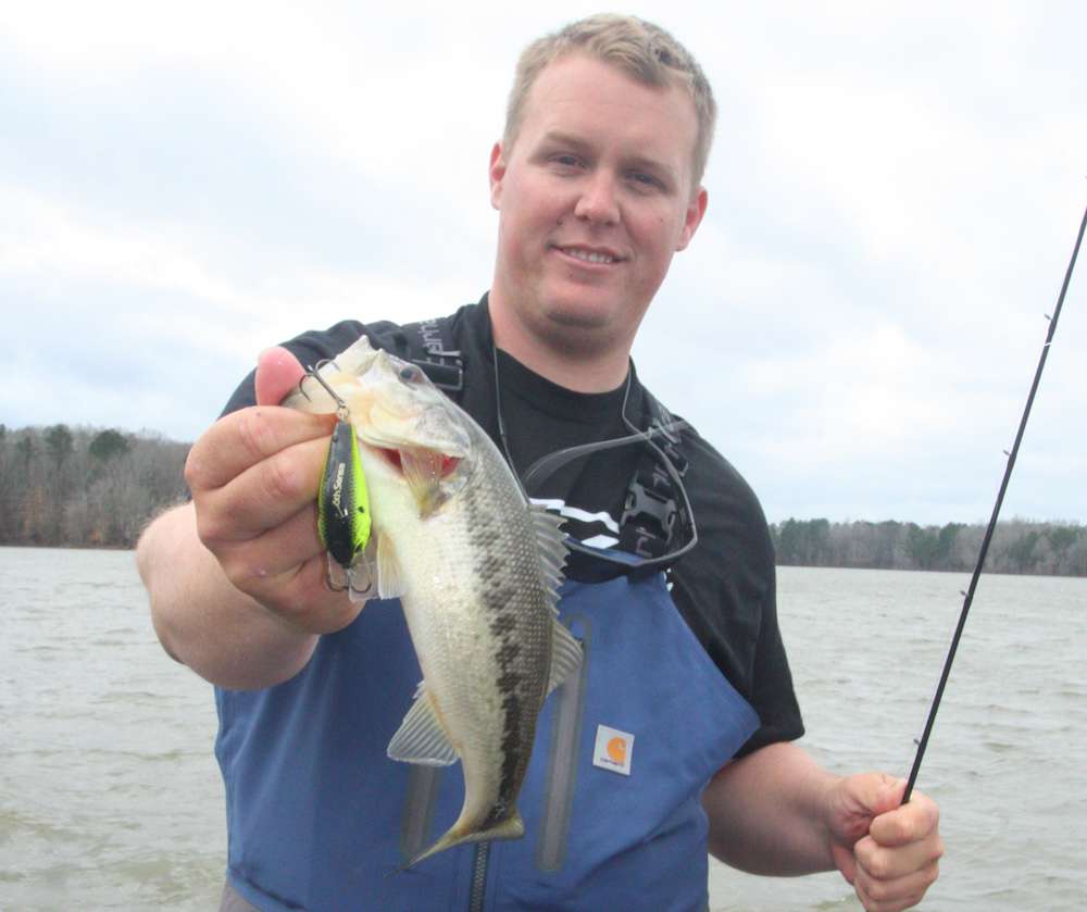 <b>4 HOURS LEFT</b><br>
<b>9:40 a.m.</b> Whitaker ties on a chartreuse/black back 6th Sense Crush 50X squarebill crankbait and heads upwind, casting it parallel to the rocky channel bank. His reel backlashes on his first cast; he quickly dials it in to meet the gusty conditions. <br>
<b>9:49 a.m.</b> Whitaker catches his first keeper largemouth of the day, 1 pound even, on the squarebill. âThis fish was in that rough water at the end of this channel bank, about 3 feet deep.â <br>
<b>9:53 a.m.</b> Another cast to the same spot nets Whitakerâs second keeper, 1 pound, 3 ounces. <br>
<b>10:01 a.m.</b> Whitaker casts the squarebill to the channel bank again, and a gust of wind blows it into a shoreline tree. Rather than bang up his trolling motor in the shallow rocks to retrieve the lure, he breaks it off, ties on an identical plug and resumes cranking. âHopefully, some kid will find that lure and catch a big one on it some day!â <br>
<b>10:08 a.m.</b> Whitaker hasnât had another strike on the channel bank, so he replaces the chartreuse 50X with the same lure in citrus shad. âThis color pattern is similar but has some blue in it. Sometimes even a slight color change will get âem fired up again.â <br>
<b>10:11 a.m.</b> The citrus shad squarebill wedges between shallow rocks, and Whitaker reluctantly breaks it off. Whatâs his take on the day so far? âOther than the fact that Iâm burning through my crankbait stash, the bite has picked up some, and I definitely think windy banks will continue to be a key factor today. Iâve been pretty much limited to fishing moving baits in shallow water because of the windy conditions, and Iâm hoping more fish move up shallow as the day progresses. I need to run back uplake and fish that rocky shoreline, if those bank fishermen ever leave it; the waterâs a lot warmer there. Until then, Iâll stick mostly with the crankbait and spinnerbait and keep covering water.â 
