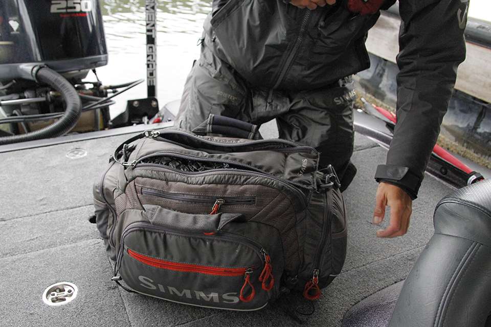 He has a tackle bag that keeps loose boxes and baits all together in the back box of the pro's boat or in the floor board.