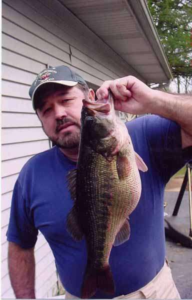 The spotted bass state record listed on the Georgia DNR web site is Wayne Hollandâs 8-2 (above) caught from Lake Burton in February 2005. A site heralding Lake Lanierâs record fish said its top spotted bass is an 8-5 landed by Patrick Bankston in May of 1985.