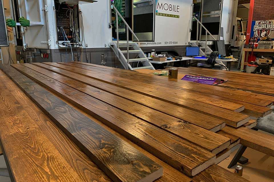 Behind the scenes, plenty of work was being done. The back of the garage was a shop and staging area for items like these recently stained boards. (Not every guy seen standing around was just 'supervising').
