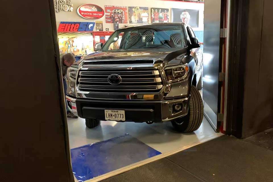 The shiny new 2019 Tundra, with 5 miles on the odometer, has arrived, and Downs navigates its trip through the double doors. 