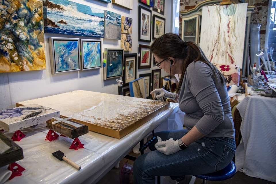 You can browse a variety of art in the Tannery Row Artist Colony, but you also can see artist like Donna Jassmann, at work.