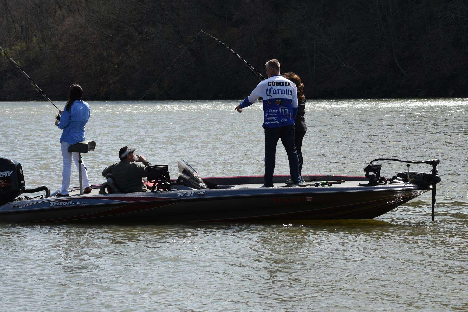 Brandon Coulter coaches First Lady Maria Lee during their brief fishing outing on the Tennessee River

