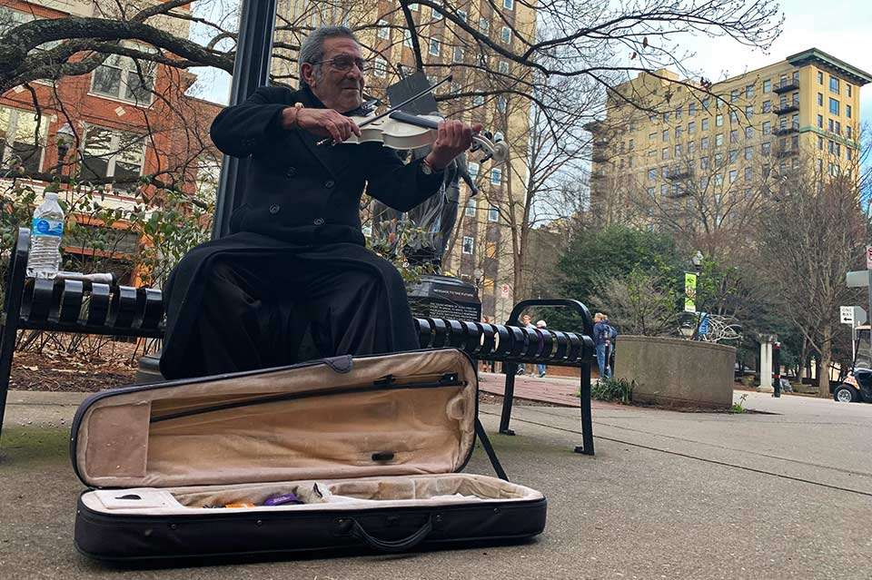 Abdul spoke little English but enjoyed playing for change. He appreciated the paper money and shook this reporterâs hand. Gina says street musicians are common in Knoxville, and she touted  Bob, who plays the saw and is a hoot.