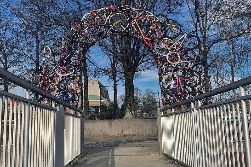 There are plenty of signs pointing out attractions, though. Getting down from the bridge to the landing requires one to walk through âKnoxvilleâs Famous Bike Arch,â which was created by artist Kelly Brown in 2012. Unique.