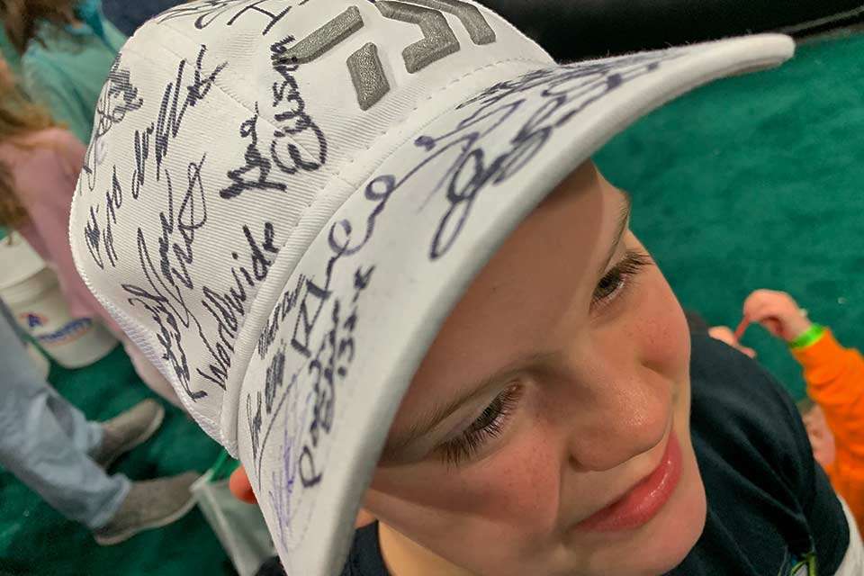 Of course, big brother, Joseph, 9, was a bit jealous she had her photo taken for Bassmaster.com. And bam! His signed hat was a great subject. The Classic is a prime place to gather autographs. He said his favorite was Jimmy Houston, or maybe his dad told him to say that.