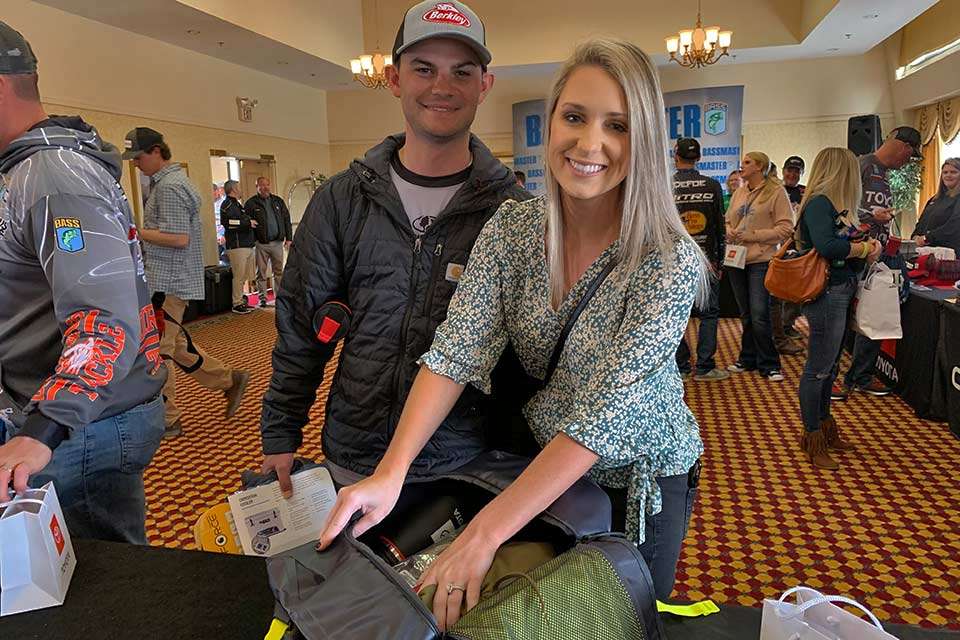 Defending Classic champ Jordan Lee and wife, Kristen, gather their swag from participating sponsors in the gifting room. While stuffing their stuff in a bag, Kristen seems to be leading with her left hand, for good reason. Check out whoâs looming in the background. 