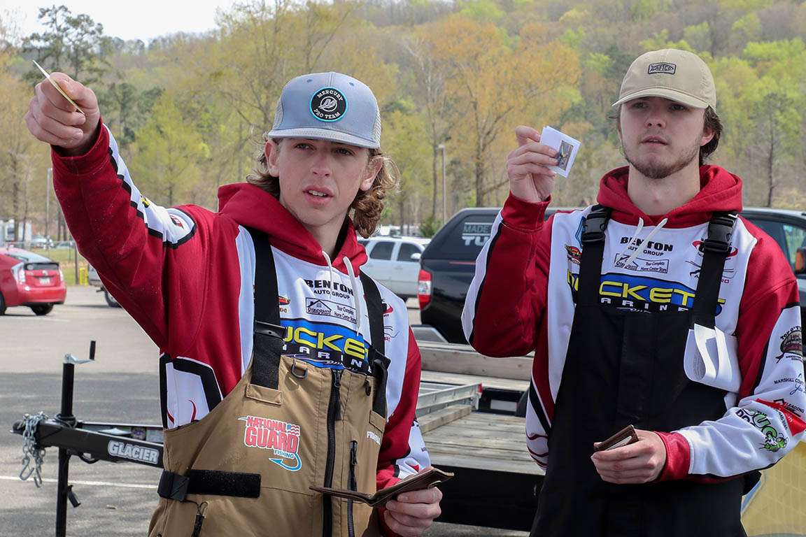 Trey McElrath and Trent Shaver of Guntersville, Ala., move among the tables.