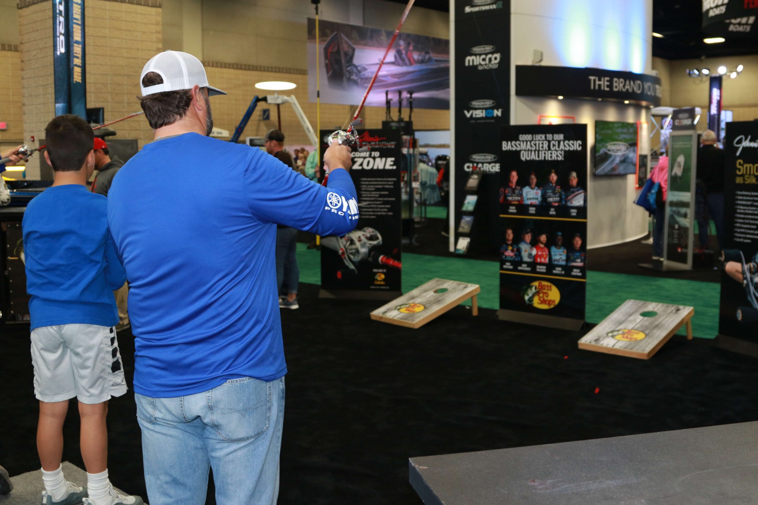 Fans test their pitching skills at the Bass Pro Shops booth.