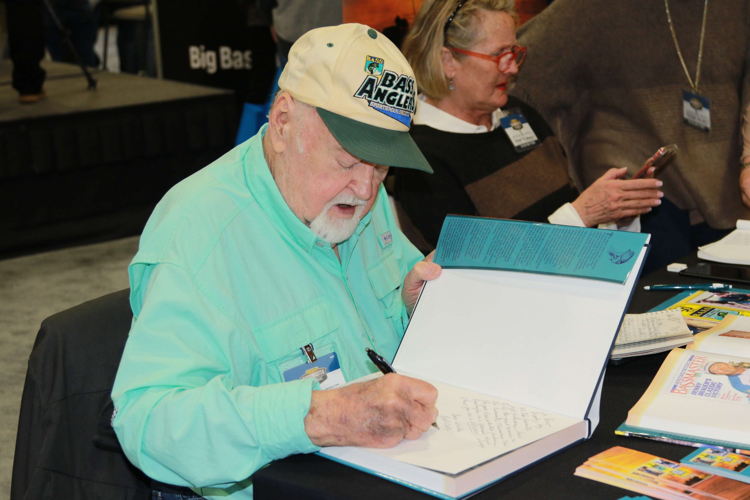 The legendary Bob Cobb signs autographs during the Bassmaster Classic Expo.
