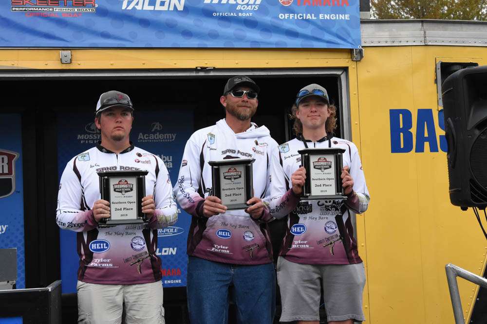 Second-place finishers Brody Robison, Levi Cox and their boat captain, Daniel
Robison