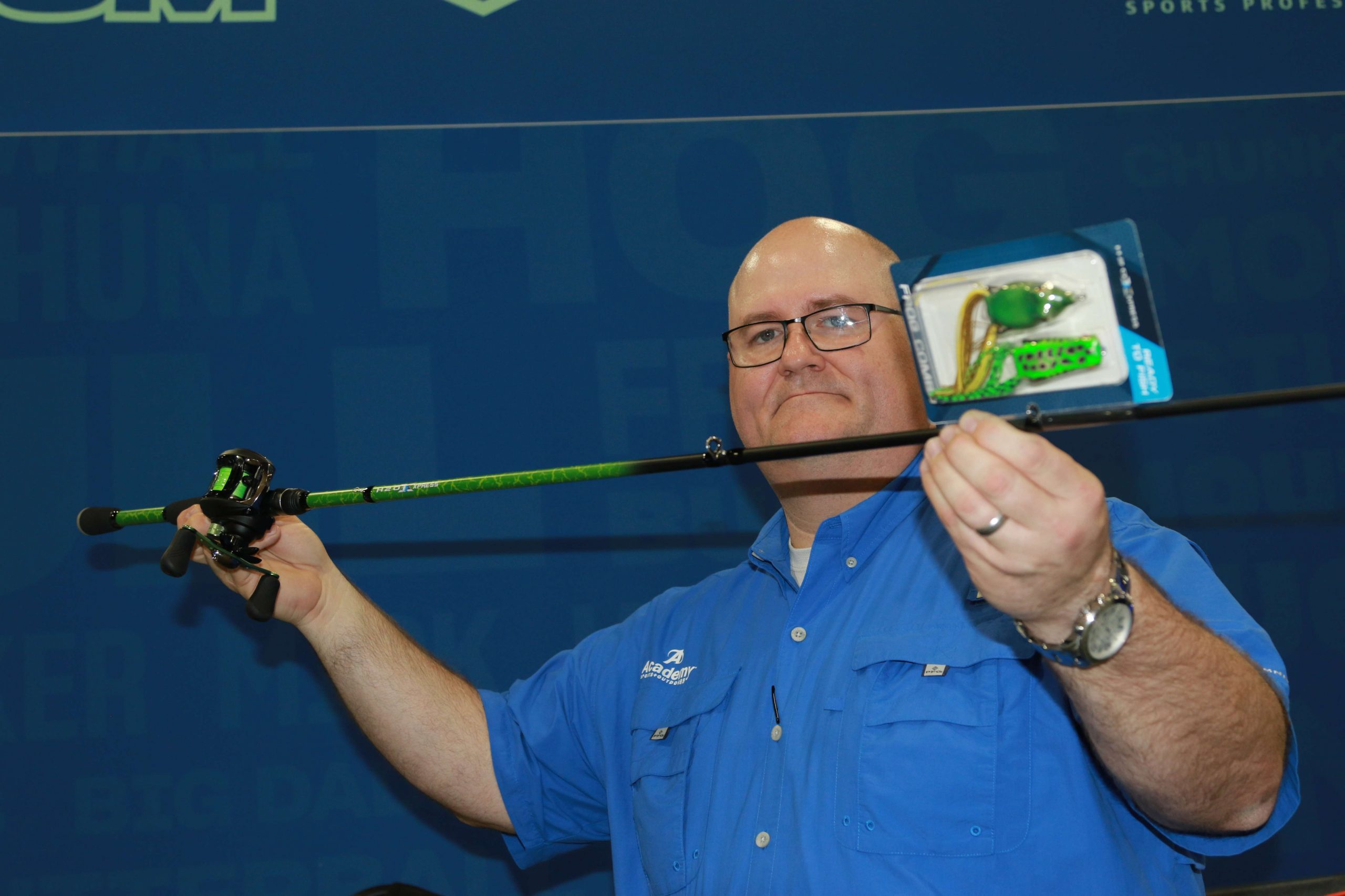 Mike Nelson of Academy Sports & Outdoors shows off one of the companyâs latest introductions â a rod/reel combo specifically packaged for frog fishing, complete with braided line and two frog styles. 