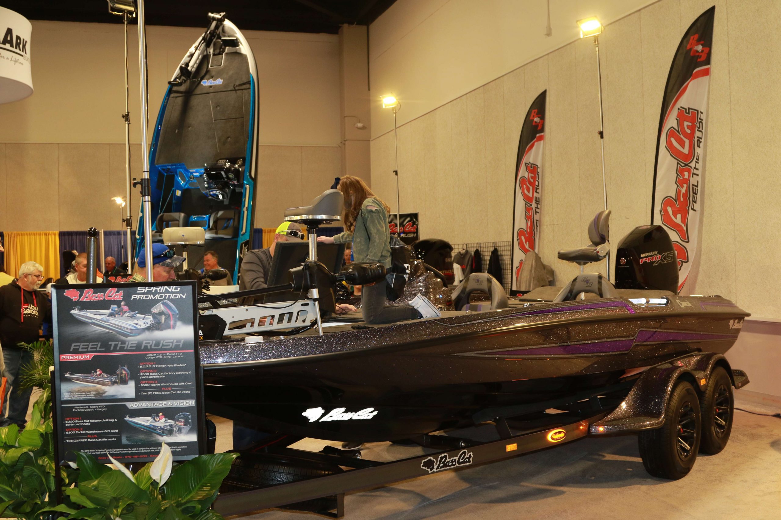 Expo visitors check out new features on various Bass Cat models.