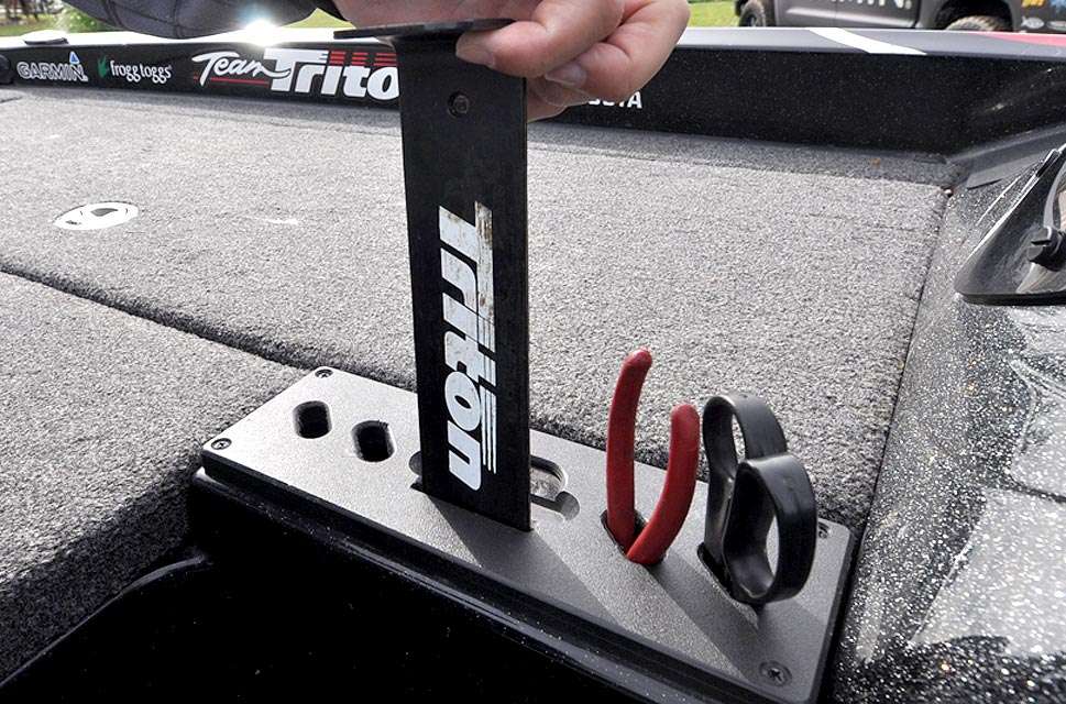 The tool holder next to the driverâs side locker keeps a measuring board handy, yet out of the way.