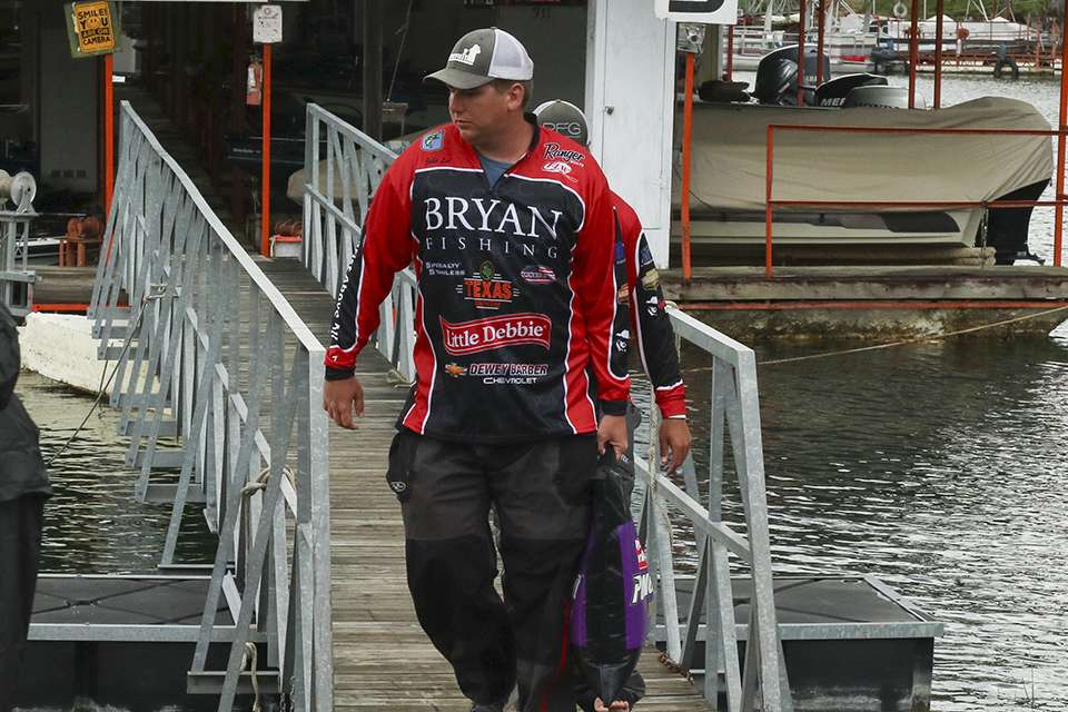Jake Lee of Bryan College takes his fish to the tanks. 