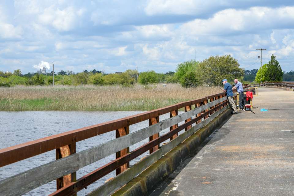 An old bridge along the waterfront has been converted to a fishing pier, allowing anglers to while away the time soaking bait. 
