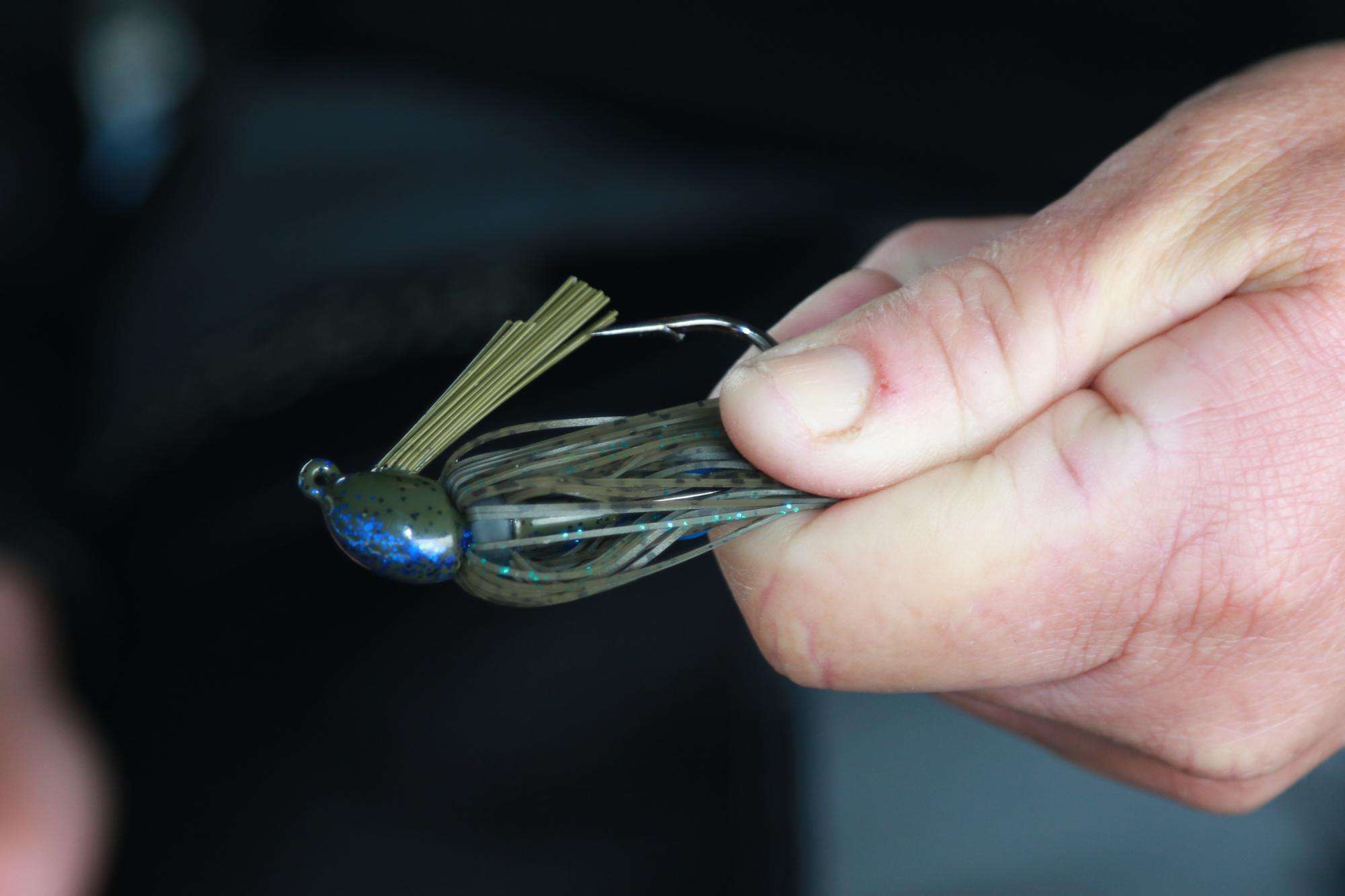 He likes his jig skirts to extend no more than a half inch below the hook bend. To neatly trim the skirt, he gathers all the fibers and pinches them against the hook.