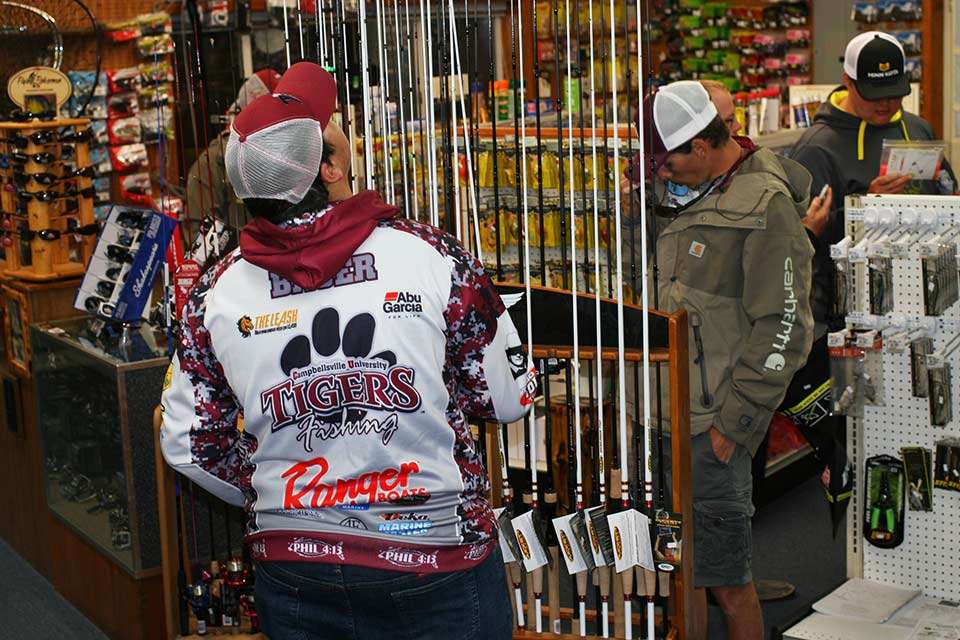 A few of the competitors, some with product in their hands, do some last-minute shopping in the Bull Shoals Boat Dock store.
