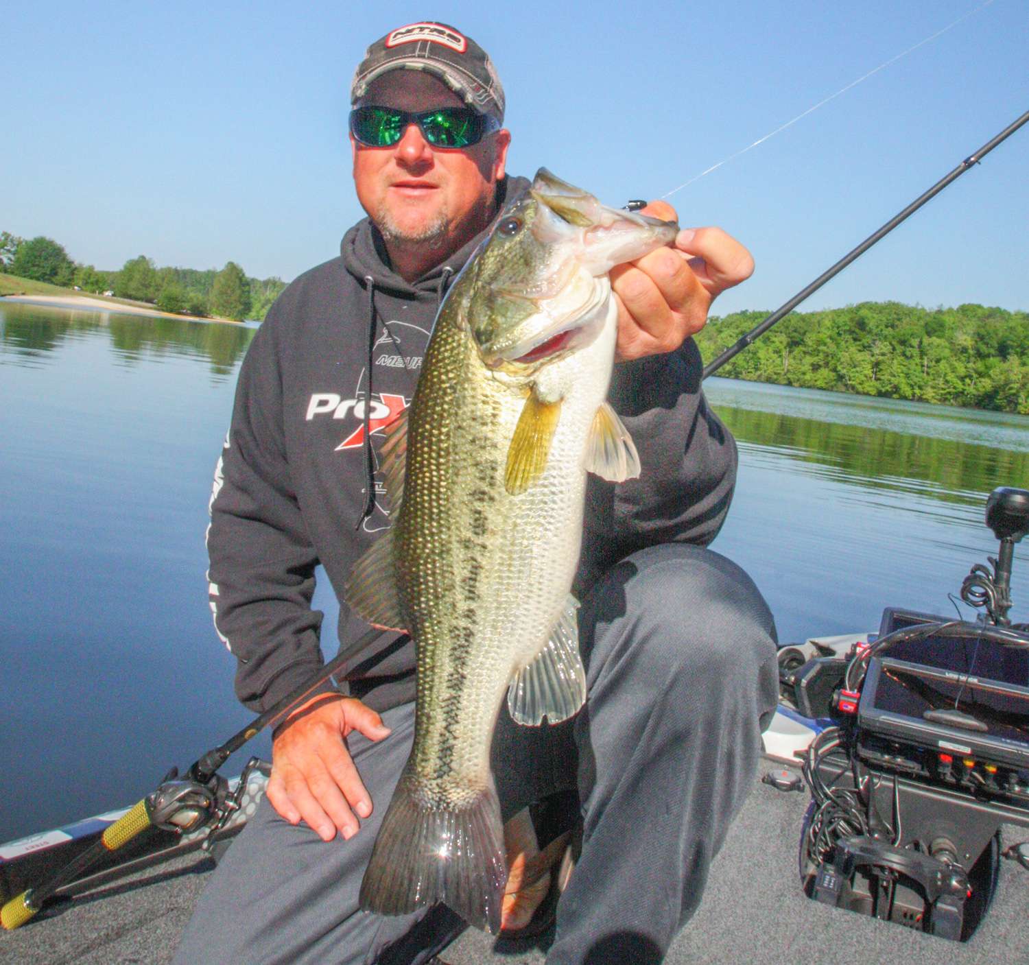 <b>8:35 a.m.</b> Hartman moves to the mouth of the cove, casts the brush hog to a shallow point and hangs a good fish. He works it to the boat and swings aboard a fine 3-5 largemouth. âThis fish was either on a bed or just finished spawning. Its tail is rubbed raw.â
