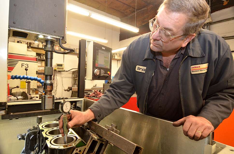 Bryan Freehling measures a honed cylinder to make sure it meets the proper specs. Freehling runs all the high-tech machinery at Blackbird and has worked there for 10 years. He also has 39 years of experience as an engine machinist.