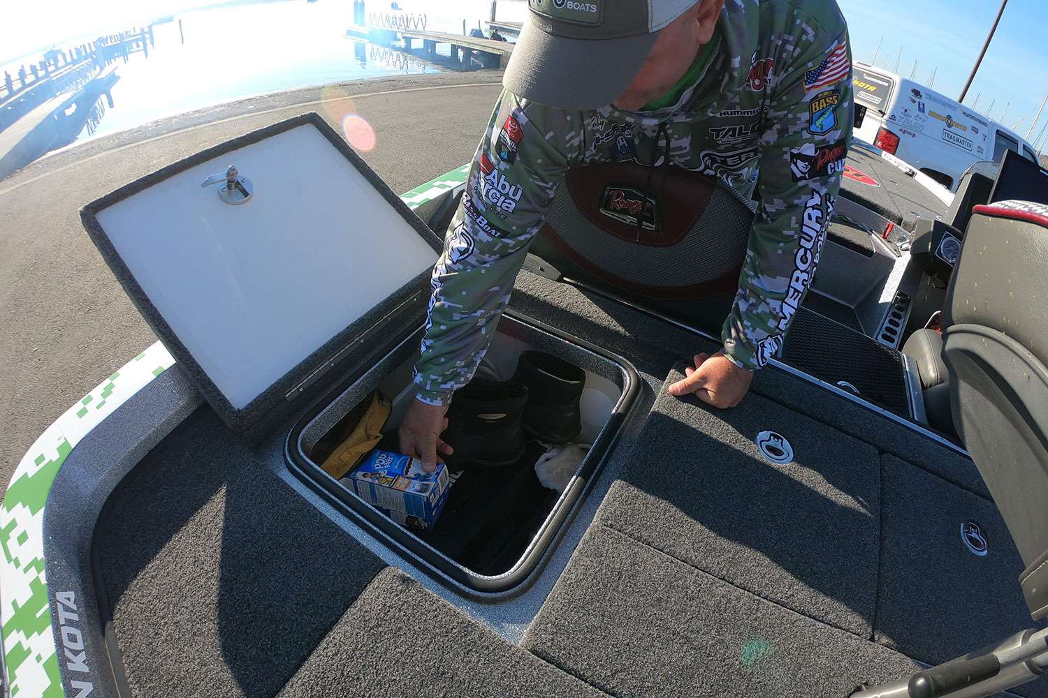 Moving to the rear deck, Kreiger digs into a storage box that holds tackle, tools and something else ... what is that?